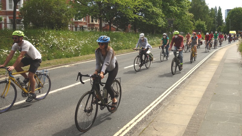 Cyclists demonstrate socially distanced cycling on Western Way, Exeter