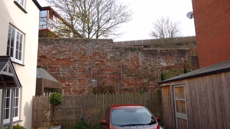 Exeter city wall behind private gardens in Northernhay Street