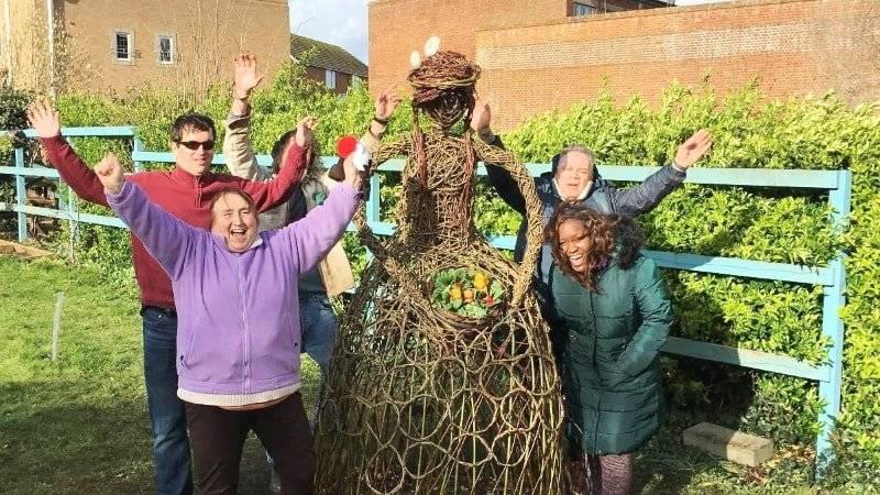 St Sidwell's Community Centre volunteers with Sidwella willow sculpture
