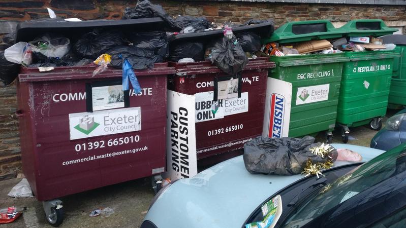 Overflowing council rubbish bins in Exeter city centre