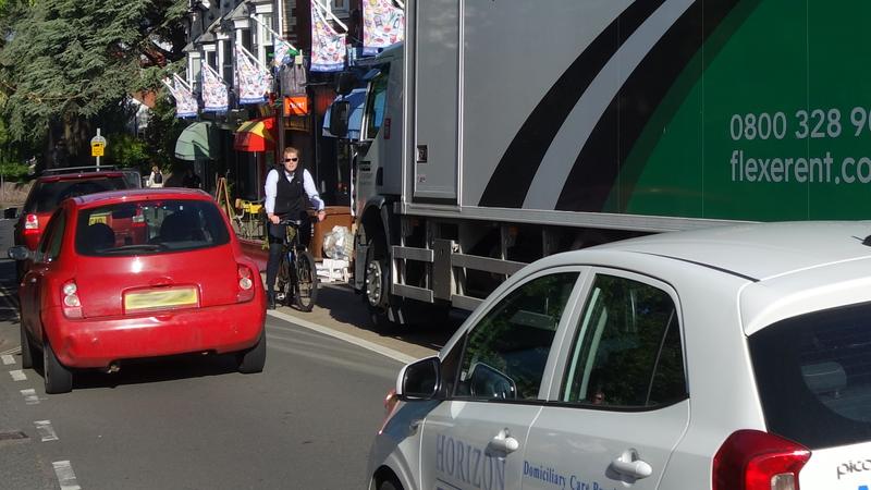 Lorry parked in loading bay obstructing cycle lane endangering cyclist