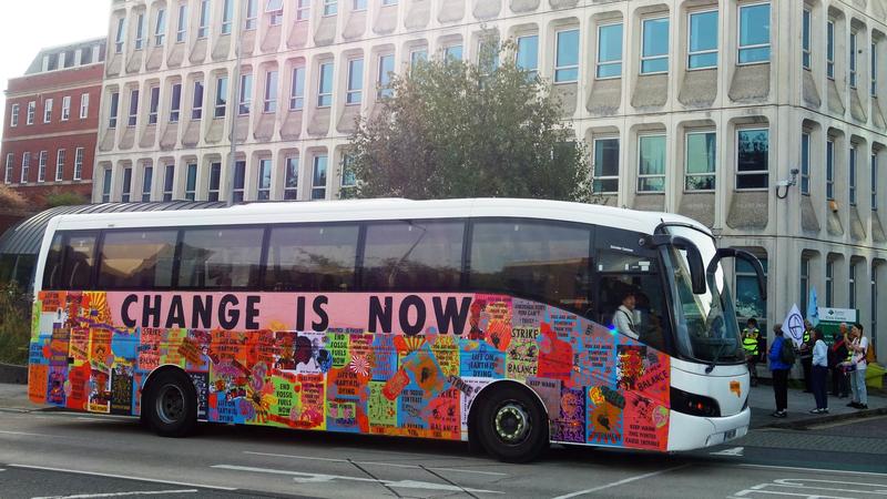 Extinction Rebellion UK tour bus outside Exeter City Council's Paris Street offices