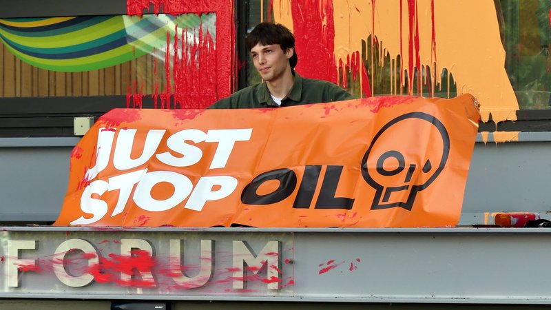 Just Stop Oil protestor George Simonson on the University of Exeter Forum entrance portico