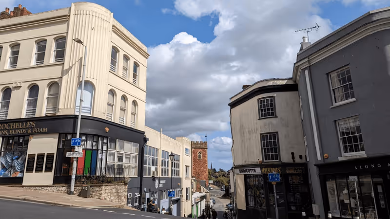 Corner of Fore Street and West Street with St Mary Steps church in the background