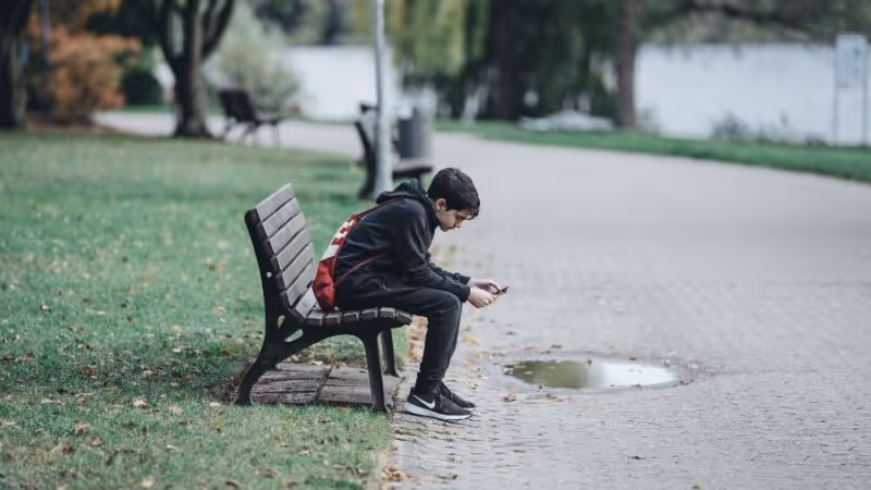 Child on park bench