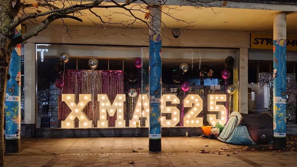 Rough sleeper shelter beside Paris Street shop window