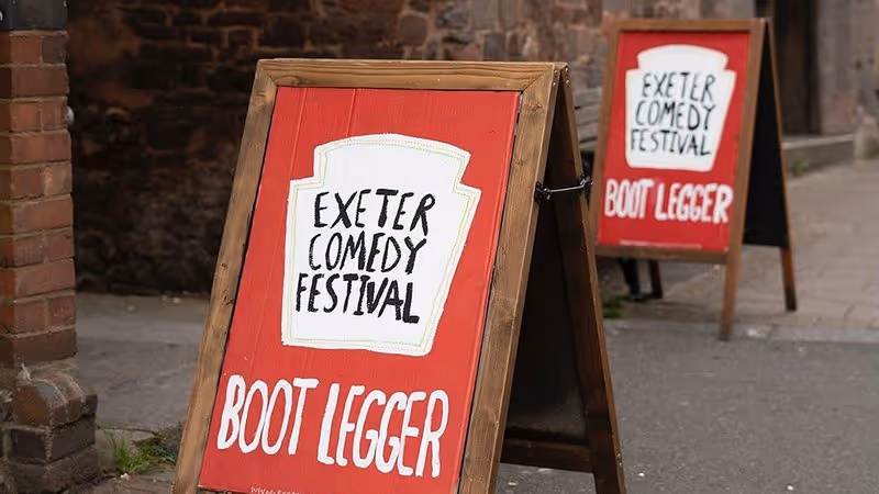 Exeter Comedy Festival signs outside The Bootlegger
