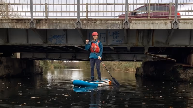 Exeter Harbour Board member Shelley Rhodes demonstrates current Exeter Ship Canal swing and bascule bridge air draft restrictions