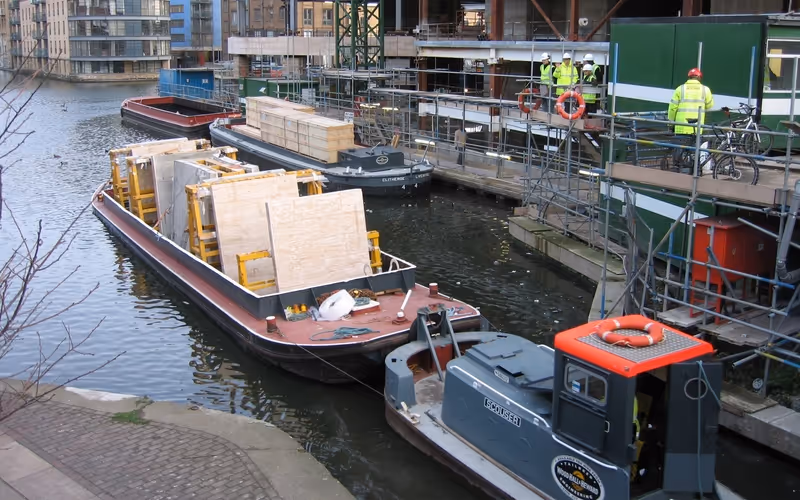 King's Place redevelopment construction materials being delivered by barge on Regent's Canal in King's Cross, London